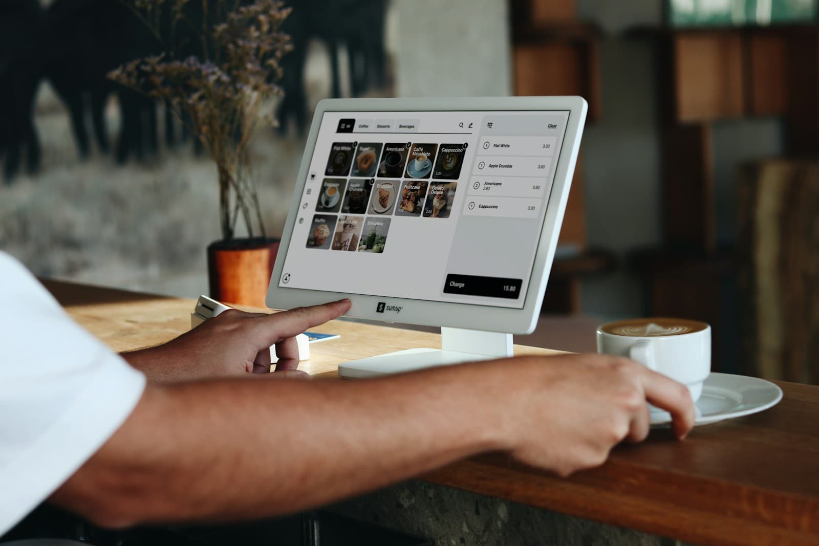 An owner-led business using a custom point-of-sale system at the counter — an example of the practical, fit-to-workflow tools Founder's Point builds.