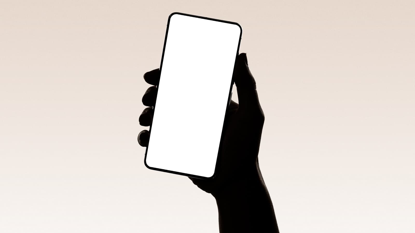 A hand holding a smartphone — representing the custom mobile apps shipped by Founder's Point to the App Store and Google Play.