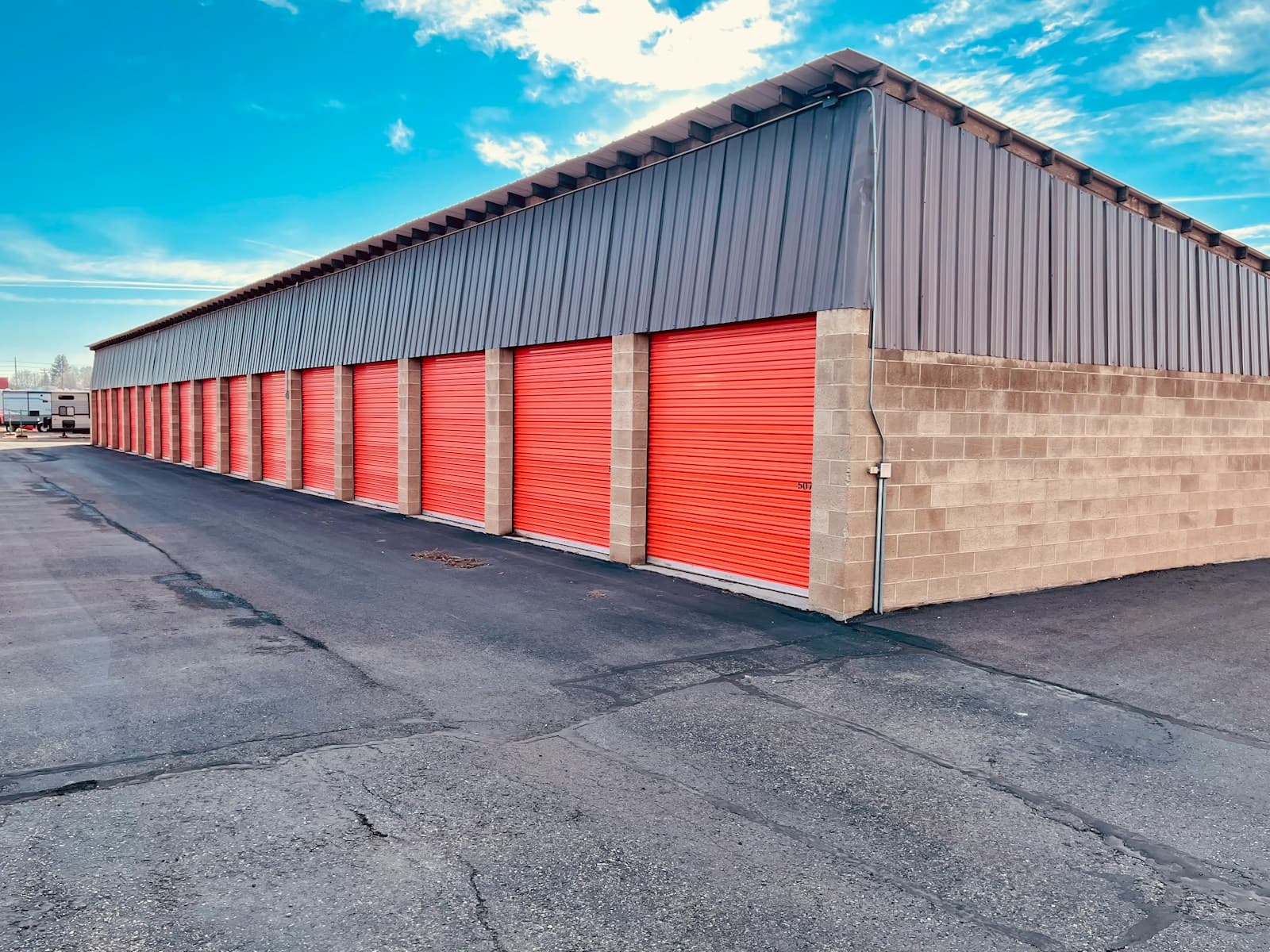 A row of self-storage unit doors at a modern storage facility — the kind of operation Founder's Point helps automate for payments, gate codes, and tenant communication.
